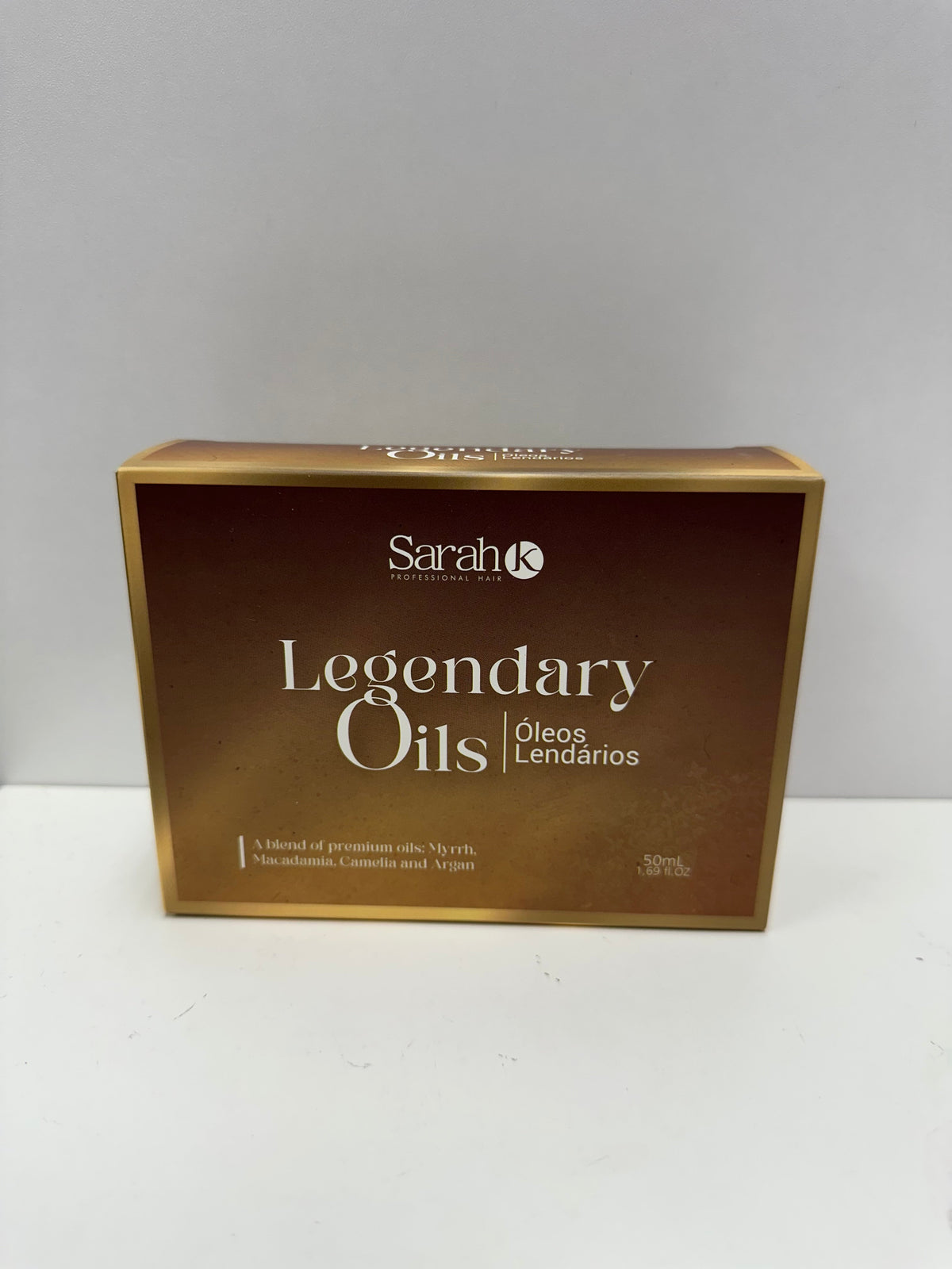 Sarah K Legendary Oils gold gift box packaging — front view