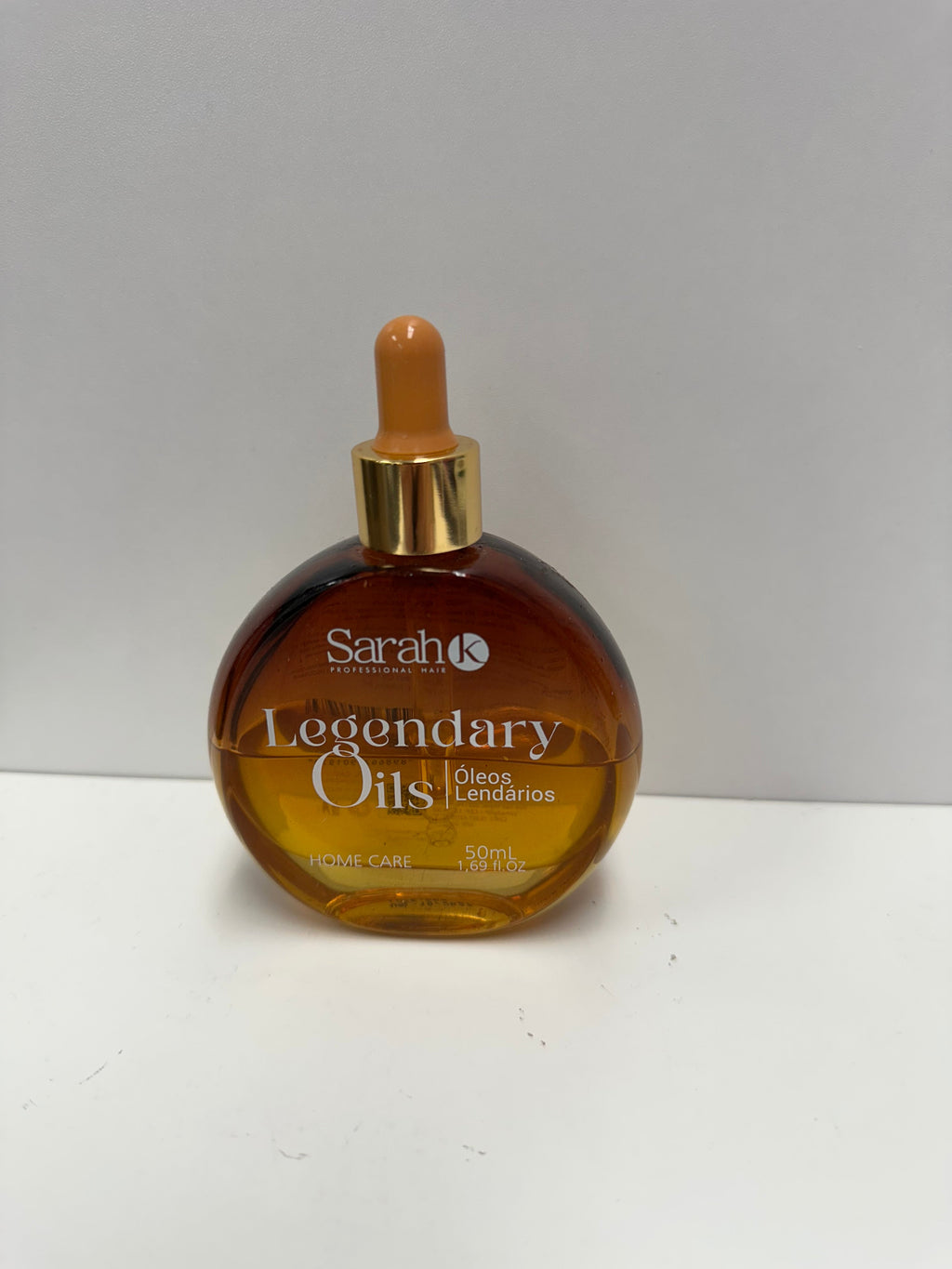 Sarah K Legendary Oils 50ml round amber glass dropper bottle with gold collar