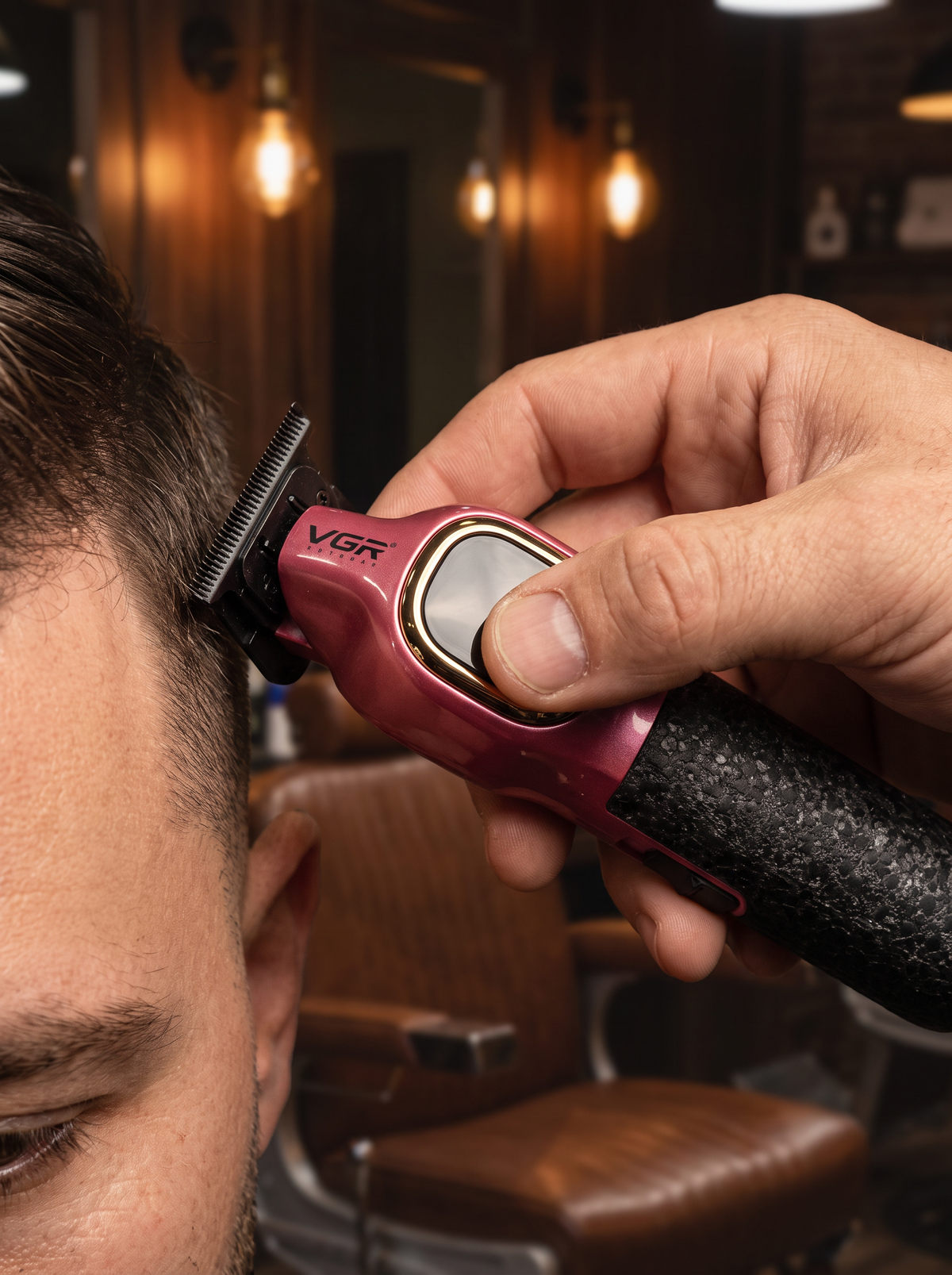 VGR pink cordless trimmer lining up a haircut