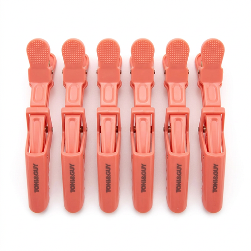 Coral crocodile sectioning clips on white